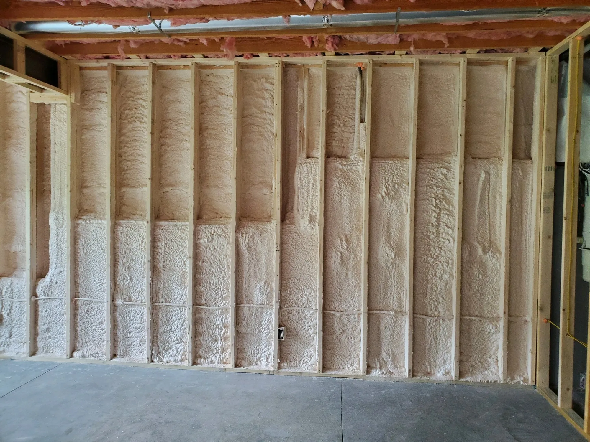 Interior wall framing prepared for insulation