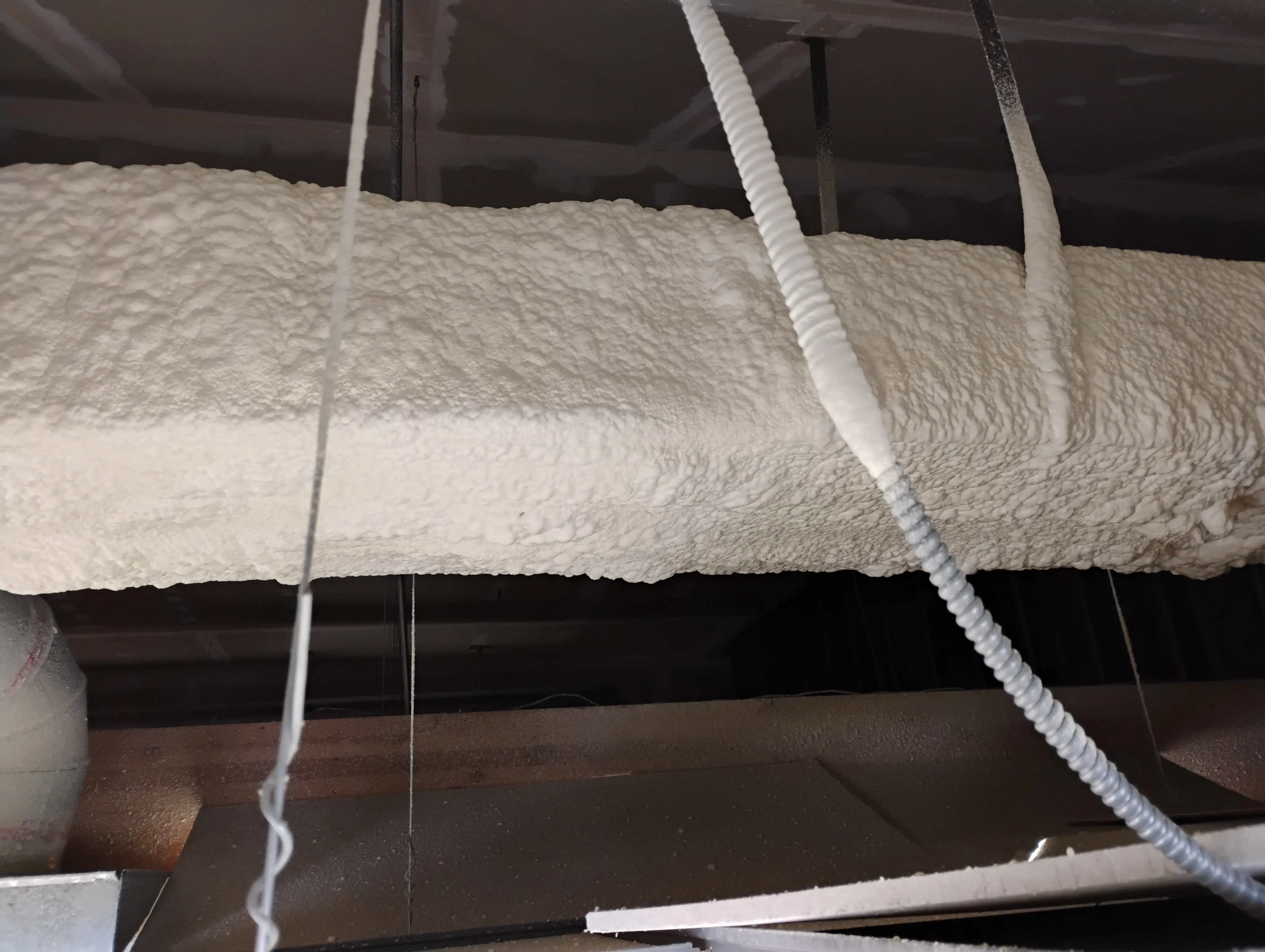 Finished spray foam around ducts and mechanical runs
